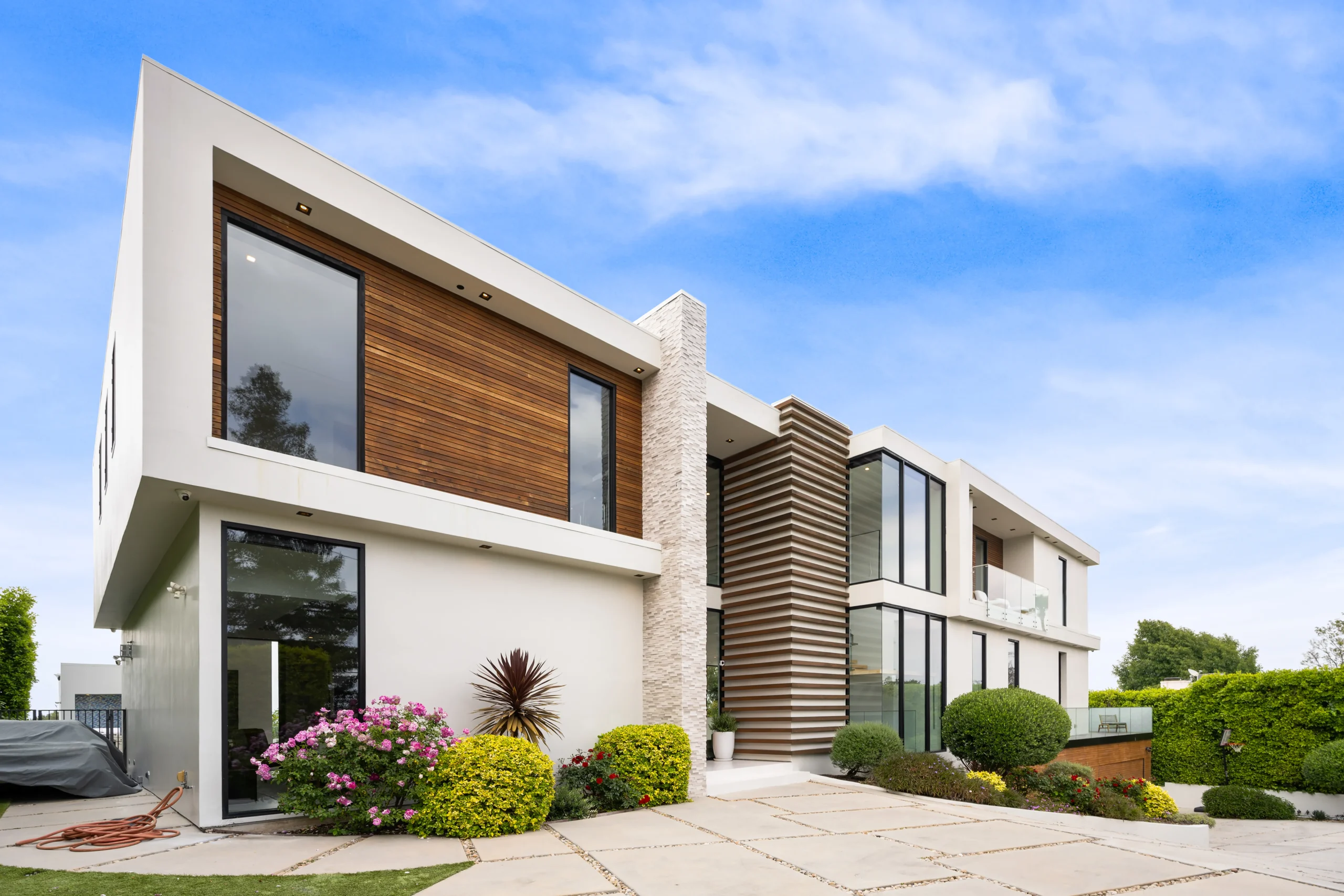 Custom home building featuring large windows and minimalist design