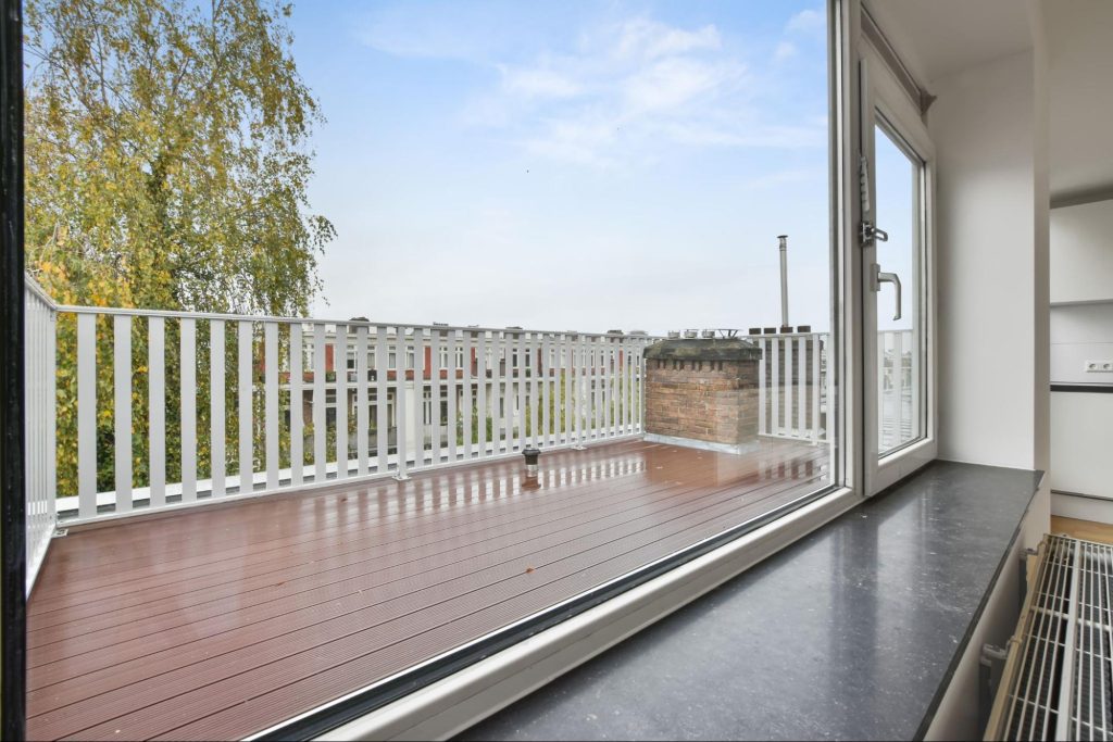 A picturesque veranda showcasing sleek and durable vinyl railings, enhancing the outdoor space's charm and safety.