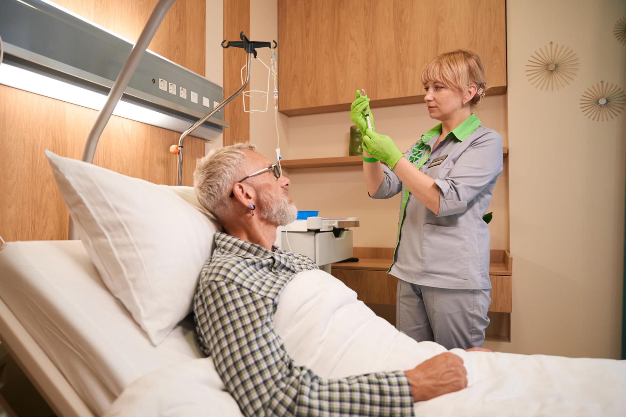 A nurse about to treat a bedridden patient.