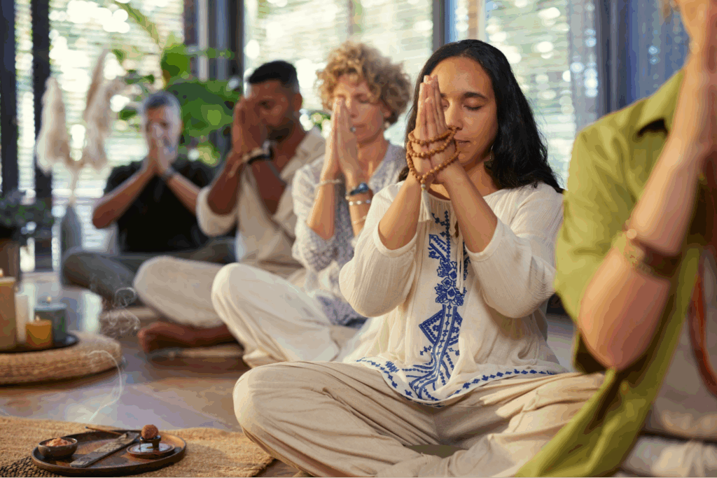A group of people meditating together.